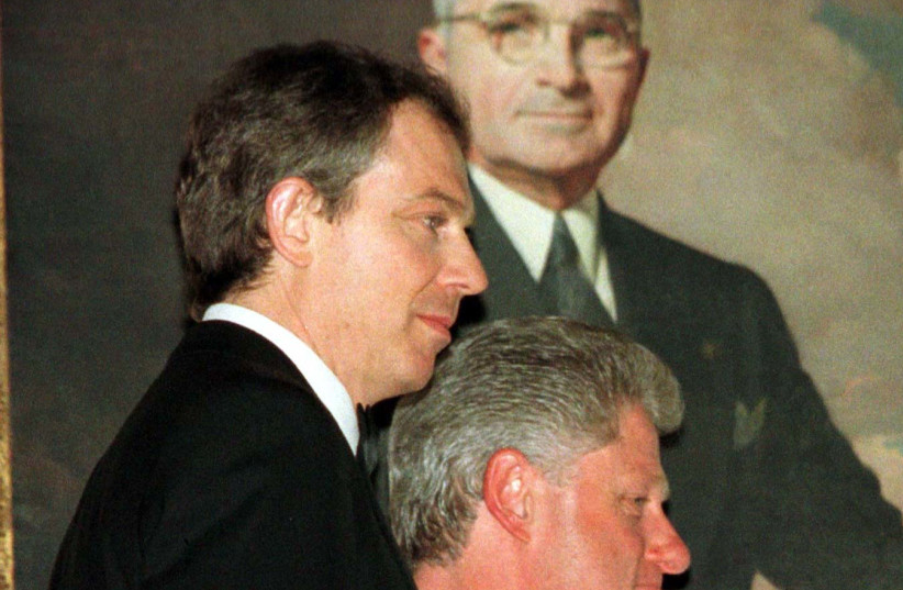  FORMER US president Bill Clinton and British prime minister Tony Blair pass a portrait of US president Harry S. Truman in the White House, 1998. Truman was critical to the founding of Israel.  (photo credit: REUTERS)