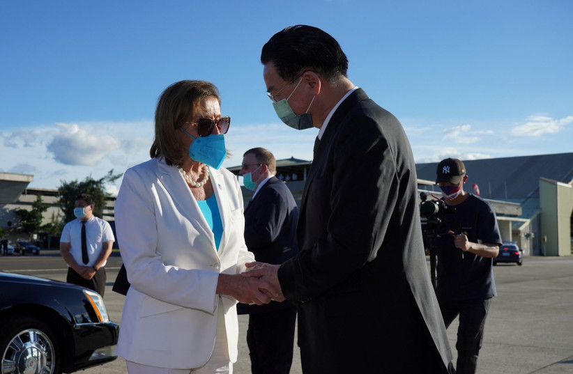  US House of Representatives Speaker Nancy Pelosi talks with Taiwan Foreign Minister Joseph Wu before boarding a plane at Taipei Songshan Airport in Taipei, Taiwan August 3, 2022. (credit: TAIWAN MINISTRY OF FOREIGN AFFAIRS/HANDOUT VIA REUTERS)