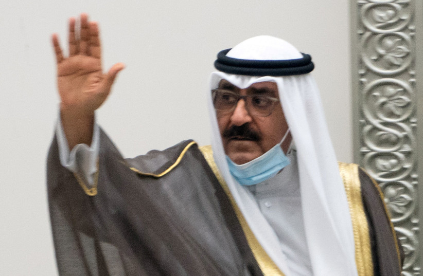 Kuwait's newly appointed crown prince Sheikh Meshal al-Ahmad Al-Jaber al-Sabah waves before he is sworn in, at the parliament, in Kuwait City, Kuwait, October 8, 2020. (photo credit: REUTERS/STEPHANIE MCGEHEE)