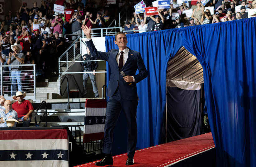 Arizona Republican Senate candidate Blake Masters waves during former US President Donald Trump's rally ahead of Arizona primary elections, in Prescott Valley, Arizona, US, July 22, 2022. (credit: REUTERS/REBECCA NOBLE)