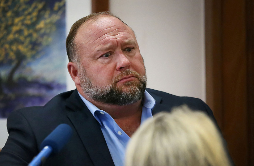  Alex Jones attempts to answer questions about his emails asked by Mark Bankston, lawyer for Neil Heslin and Scarlett Lewis, during trial at the Travis County Courthouse, Austin, Texas, US, August 3, 2022.  (photo credit:  BRIANA SANCHEZ/POOL VIA REUTERS)