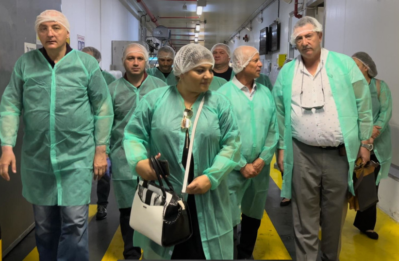  MEMBERS OF A delegation from Georgia with their Israeli hosts at a Tnuva production plant. (photo credit: Tnuva)