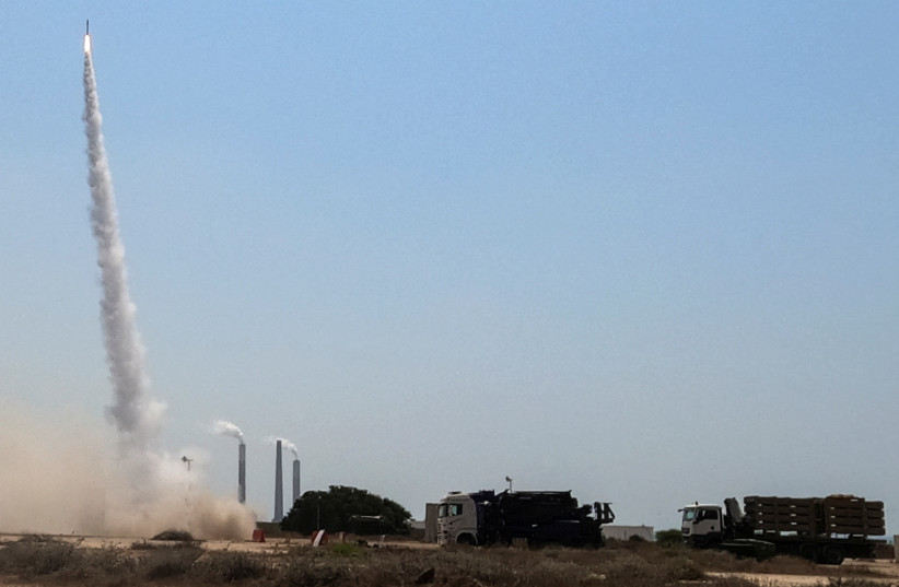  Israel's Iron Dome anti-missile system fires to intercept a rocket launched from the Gaza Strip towards Israel August 6, 2022 (photo credit: REUTERS/ILAN ROSENBERG)