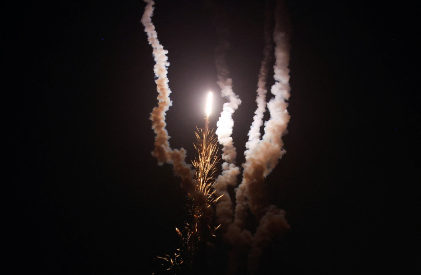 Rockets are fired by Palestinian militants into Israel, amid Israel-Gaza fighting, in Gaza, August 6, 2022. (photo credit: REUTERS/IBRAHEEM ABU MUSTAFA)