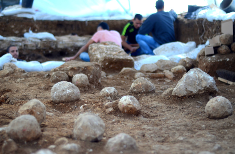  The Russian Compound excavation site. The ballista stones, the physical evidence of the battle that took place 2000 years ago, are visible on the floor.  (photo credit: YOLI SCHWARTZ/ISRAEL ANTIQUITIES AUTHORITY)