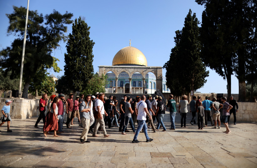  Jews visit the compound known to Muslims as Noble Sanctuary and to Jews as Temple Mount in Jerusalem's Old City as Israel marks Tisha Be'av, the ninth day in the Hebrew month of Av, the destruction of the First and Second Temples, August 7, 2022. (credit: AMMAR AWAD/REUTERS)