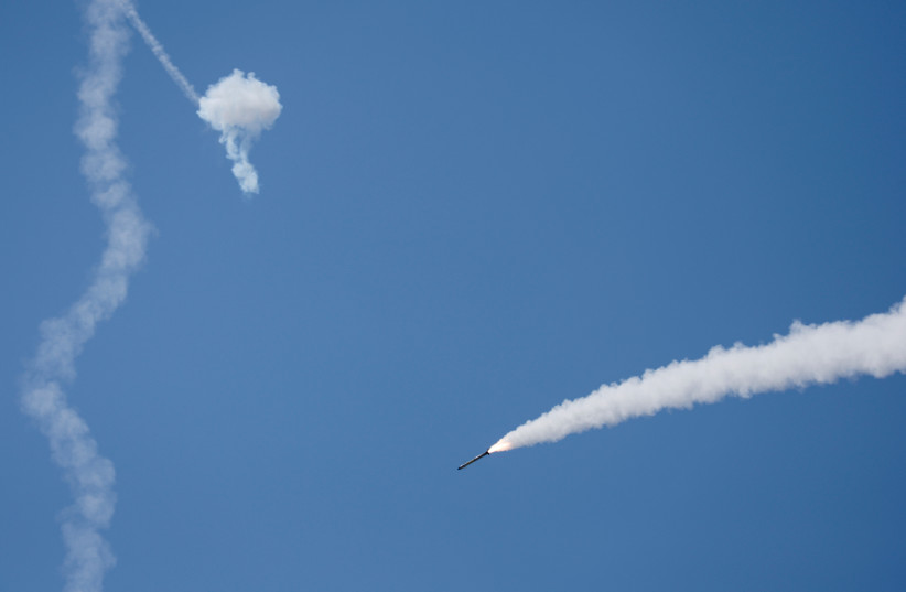  An Iron Dome anti-missile system fires an interceptor missile as a rocket is launched from the Gaza Strip towards Israel, at the sky near the Israel-Gaza border August 7, 2022. (credit: AMIR COHEN/REUTERS)