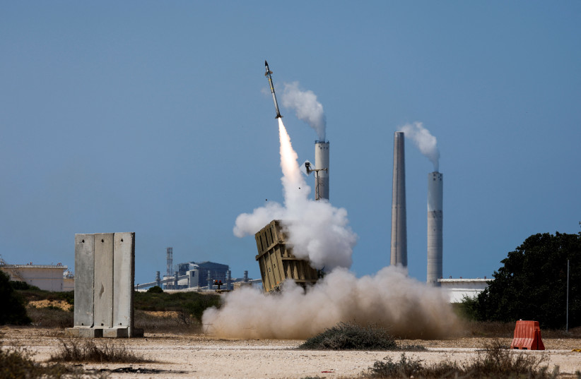  An Iron Dome anti-missile system fires an interceptor missile as a rocket is launched from the Gaza Strip towards Israel, at the sky near the Israel-Gaza border August 7, 2022. (photo credit: AMIR COHEN/REUTERS)