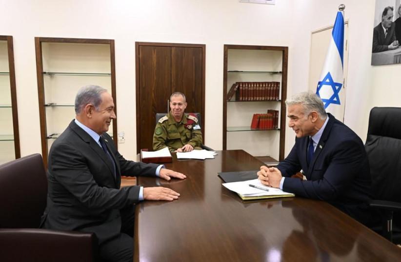  Benjamin Netanyahu meets with Prime Minister Yair Lapid to receive a briefing on the ongoing Operation Breaking Dawn, August 7, 2022 (photo credit: CHAIM TZACH/GPO)