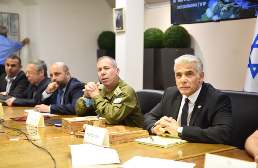  Prime Minister Yair Lapid holds a situational assessment during Operation Breaking Dawn, August 6, 2022 (photo credit: KOBI ALKOTZER/GPO)
