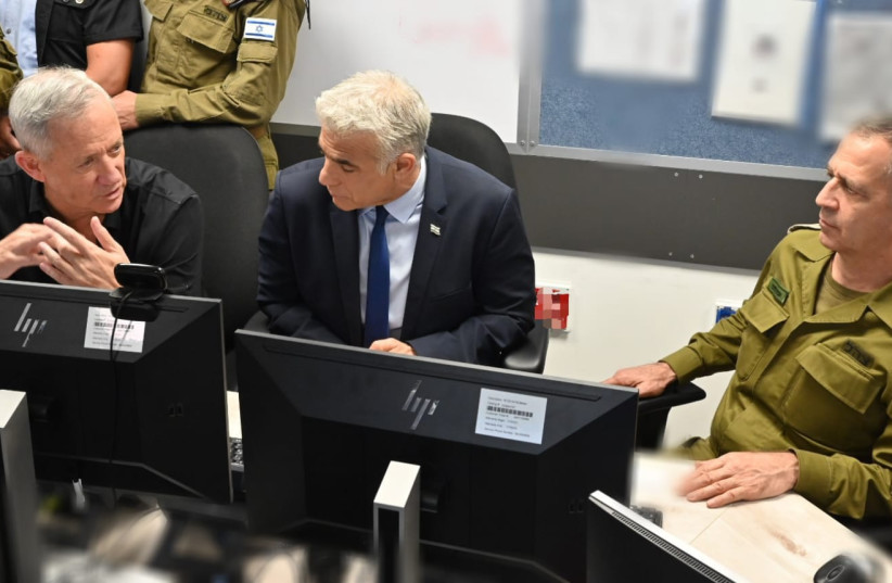 Left to Right: Defense Minister Benny Gantz, Prime Minister Yair Lapid and  IDF Chief of Staff Lt.-Gen. Aviv Kohavi visit the IDF southern command during Operation Breaking Dawn. (credit: DEFENSE MINISTRY)