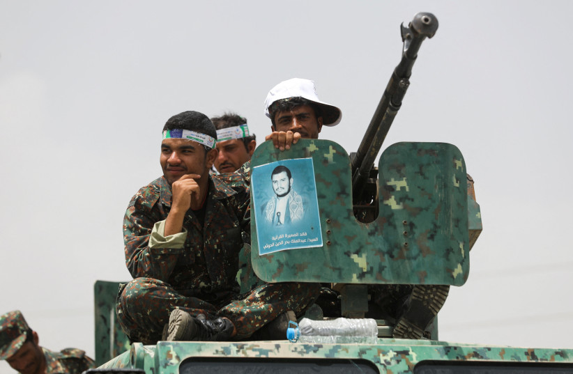  Houthi police troopers sit atop an armored personnel carrier securing a rally held to mark the Ghadeer day, in Sana'a, Yemen on July 17, 2022 (credit: REUTERS/KHALED ABDULLAH)