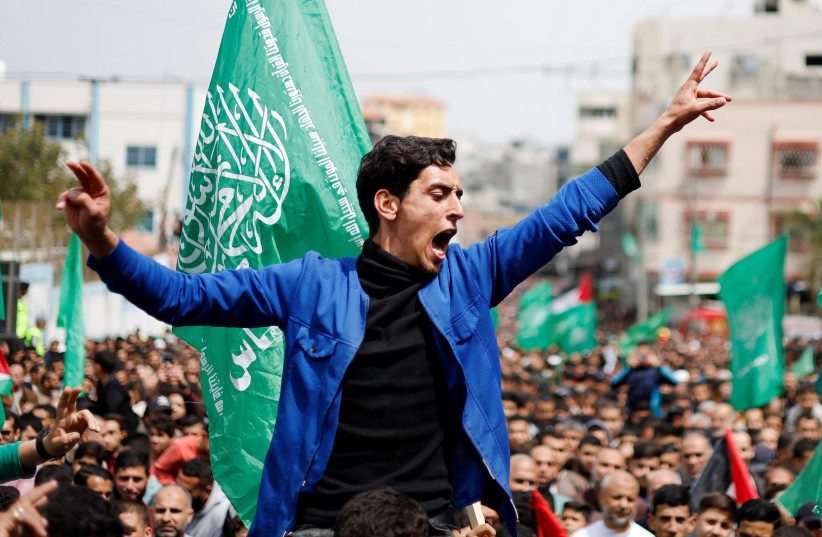  A Palestinian Hamas supporter attends a protest to support Al-Aqsa mosque, in the northern Gaza Strip April 22, 2022. (photo credit: REUTERS/MOHAMMED SALEM)