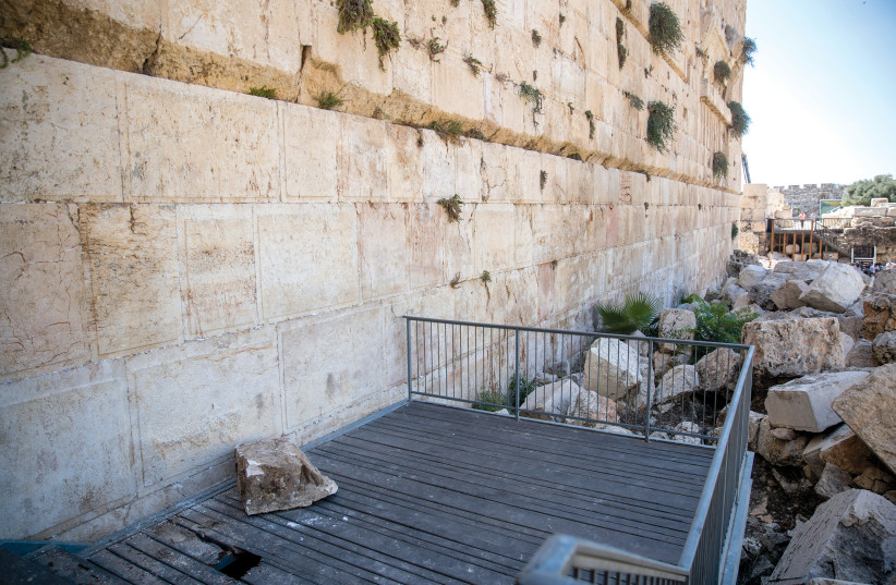  A rock fell on the egalitarian section at the Western Wall shortly after the end of the fast of Tisha Be’av on July 22, 2018. (photo credit: MARC ISRAEL SELLEM)