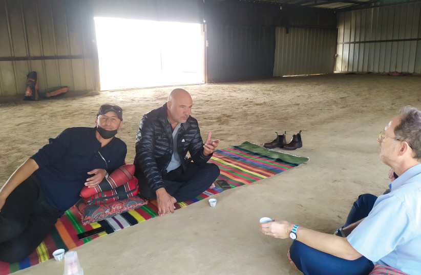  Raed al-Kinnan and Hajj Moussa Tarabin discuss the need for a government decision to advance more solar projects. Tarabin is the pioneer of solar in the Bedouin sector, with a 10MW solar field that was nixed by Israel’s regulator but eventually was built in 2018. (credit: MICHA PRICE)