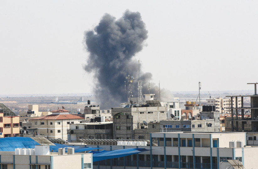  SMOKE RISES during an Israeli airstrike in Rafah, Gaza Strip, on Sunday. (photo credit: ABED RAHIM KHATIB/FLASH90)