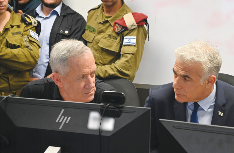  PRIME MINISTER Yair Lapid and Defense Minister Benny Gantz consult during Operation Breaking Dawn (credit: ARIEL HERMONY/DEFENSE MINISTRY)