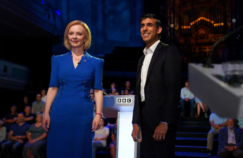  Candidates Rishi Sunak and Liz Truss stand before taking part in the BBC Conservative party leadership debate at Victoria Hall in Hanley, Stoke-on-Trent, Britain, July 25, 2022.  (photo credit: JACOB KING/POOL VIA REUTERS)