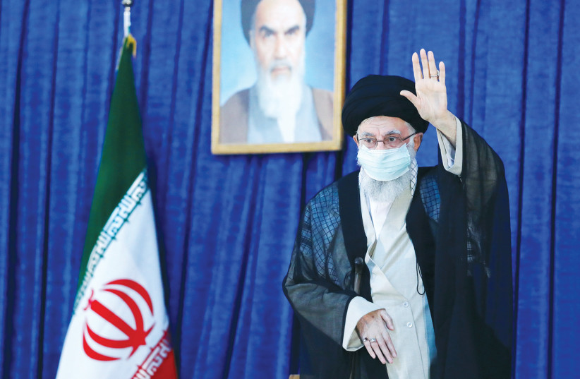  IRAN’S SUPREME Leader Ayatollah Ali Khamenei gestures, marking the 33rd anniversary of the death of the leader of the 1979 Islamic Revolution, Ayatollah Ruhollah Khomeini, Tehran, in June.  (photo credit: Office of the Iranian Supreme Leader/West Asia News Agency/Reuters)