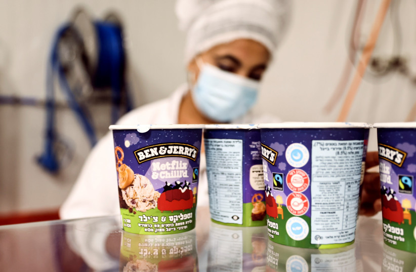  Tubs of ice-cream are seen as a labourer works at Ben & Jerry's factory in Be'er Tuvia, Israel July 20, 2021.  (credit: RONEN ZVULUN/REUTERS)