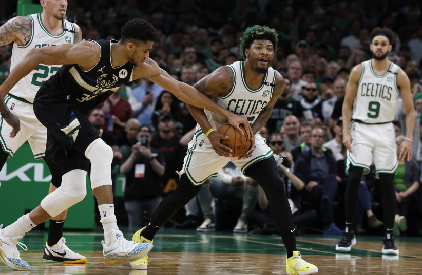  May 15, 2022; Boston, Massachusetts, USA; Milwaukee Bucks forward Giannis Antetokounmpo (34) tries to strip the ball from Boston Celtics guard Marcus Smart (36) during the second quarter of game seven of the second round of the 2022 NBA playoffs at TD Garden.  (credit: WINSLOW TOWNSON-USA TODAY SPORTS)