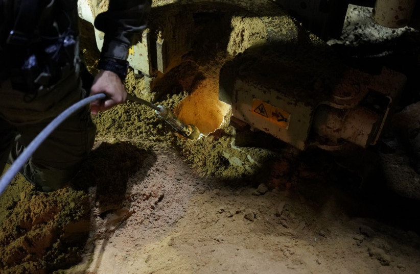  IDF fills with Hamas tunnel with material to render it inoperable. (credit: IDF SPOKESPERSON'S UNIT)