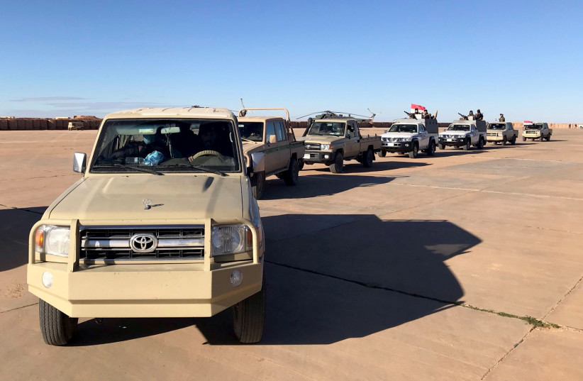  Military vehicles of Iraqi army tour at al-Waleed air base near Al-Tanf, Iraq January 18, 2021. (photo credit: REUTERS/JOHN DAVISON)