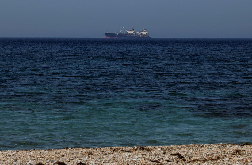  The Liberian-flagged oil tanker Ice Energy transfers crude oil from the Iranian-flagged oil tanker Lana (former Pegas), off the shore of Karystos, on the Island of Evia, Greece, May 26, 2022. (credit: REUTERS/COSTAS BALTAS)