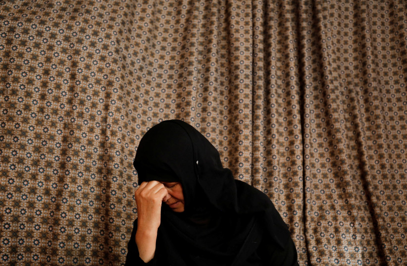  Golestan Safari, 45, feels sad after remembering her previous job in her house in Kabul, Afghanistan, August 4, 2022. (credit:  REUTERS/ALI KHARA)