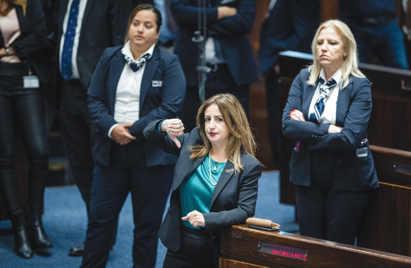  THE WRITER votes in the Knesset plenum against legislation aimed at extending the civilian status of Israelis living in the West Bank, in June. (photo credit: YONATAN SINDEL/FLASH90)