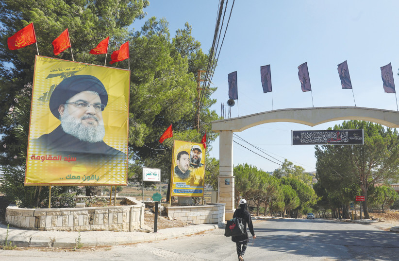  A LARGE poster depicting Hezbollah leader Hassan Nasrallah is on display in the town of Yaroun, southern Lebanon, this past week. After the just-completed Israeli operation in Gaza, Nasrallah may think twice before starting hostilities, says the writer. (photo credit: AZIZ TAHER/REUTERS)