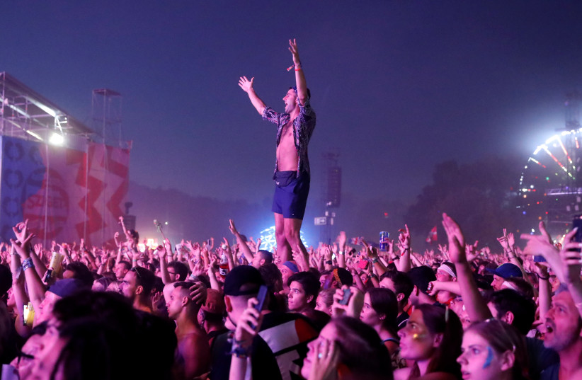  Festivalgoers attend the Sziget music festival on an island in the Danube River in Budapest, Hungary, August 11, 2019. (credit: REUTERS/BERNADETT SZABO)