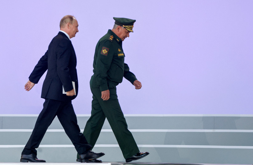 Russian President Vladimir Putin and Defence Minister Sergei Shoigu attend a ceremony opening the international military-technical forum Army-2022 at Patriot Congress and Exhibition Centre in the Moscow region, Russia August 15, 2022. (photo credit: REUTERS/MAXIM SHEMETOV)
