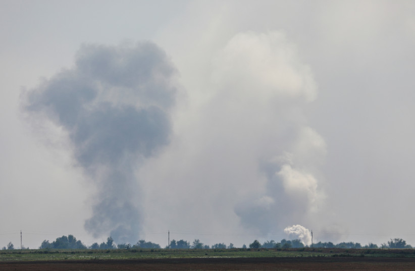 A view shows smoke rising above the area following an alleged explosion in the village of Mayskoye in the Dzhankoi district, Crimea, August 16, 2022. (photo credit: REUTERS/STRINGER)
