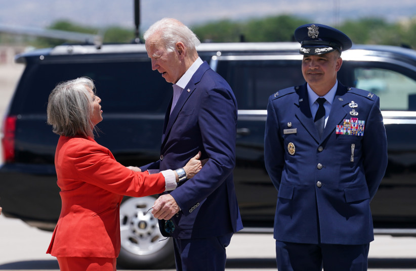  US President Joe Biden, visiting for a briefing on the wildfires plaguing the state, is greeted by New Mexico Governor Michelle Lujan Grisham upon his arrival in Albuquerque, New Mexico, US, June 11, 2022. (credit: REUTERS/KEVIN LAMARQUE)