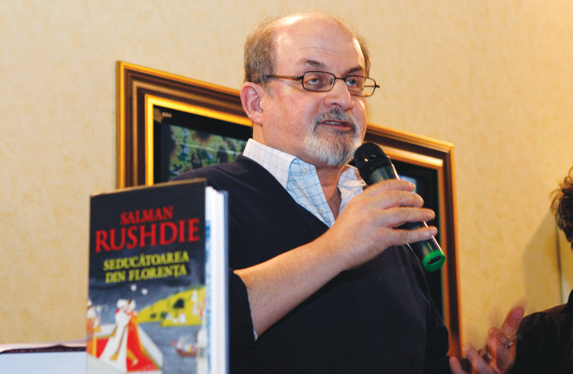  SALMAN RUSHDIE addresses an audience before a book signing event in Bucharest, in 2009.  (photo credit: ROMANIA SOCIETY MEDIA/REUTERS)