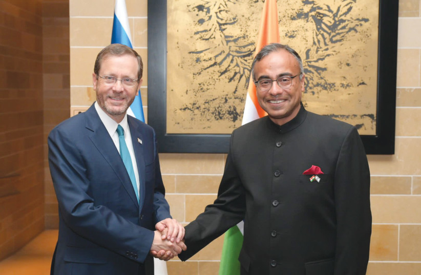  President Isaac Herzog with Indian Ambassador Sanjeev Singla. (photo credit: AMOS BEN GERSHOM/GPO)