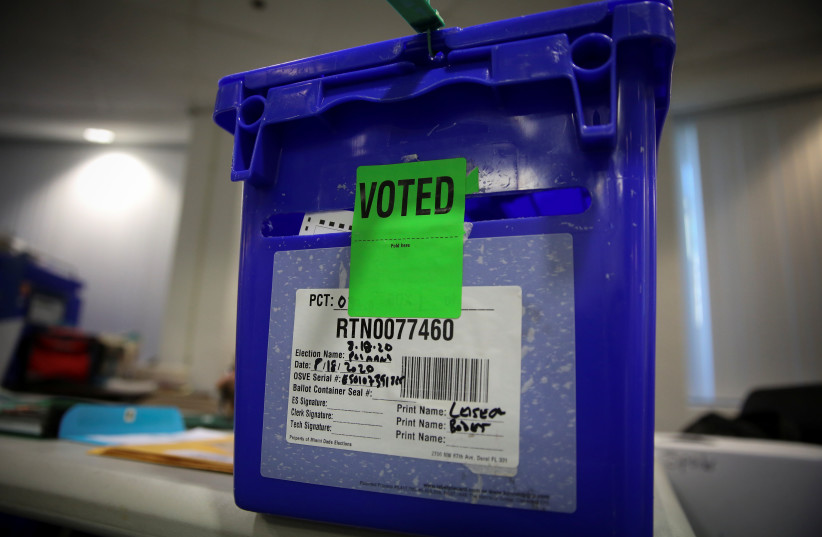  A bin containing ballots is seen at Miami Beach City Hall voting center after closing, during the primary election amid the coronavirus disease (COVID-19) outbreak in Miami Beach, Florida, US, August 18, 2020. (photo credit: REUTERS/MARCO BELLO)