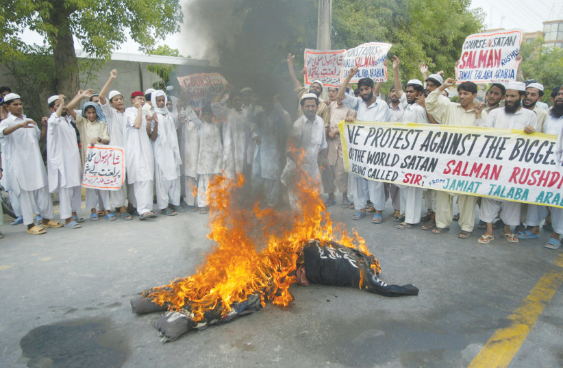  MEMBERS OF Jamiat Talaba-e-Arabia in Pakistan chant slogans against Salman Rushdie as they burn his effigy in June 2007.  (photo credit: ASIM TANVEER/REUTERS)