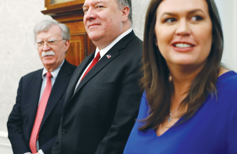  SENIOR TRUMP Administration officials – national security advisor John Bolton, secretary of state Mike Pompeo and White House press secretary Sarah Sanders stand in the Oval Office in 2019. An Iranian conspiracy to assassinate Bolton and Pompeo was recently revealed. (photo credit: KEVIN LAMARQUE/REUTERS)