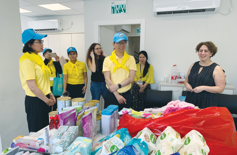  PANNABHA CHANDRARAMYA, ambassador of Thailand (left) with members of her staff at the presentation of gifts to Mothers Make a Difference and to Mesila.  (credit: Courtesy Thai Embassy)