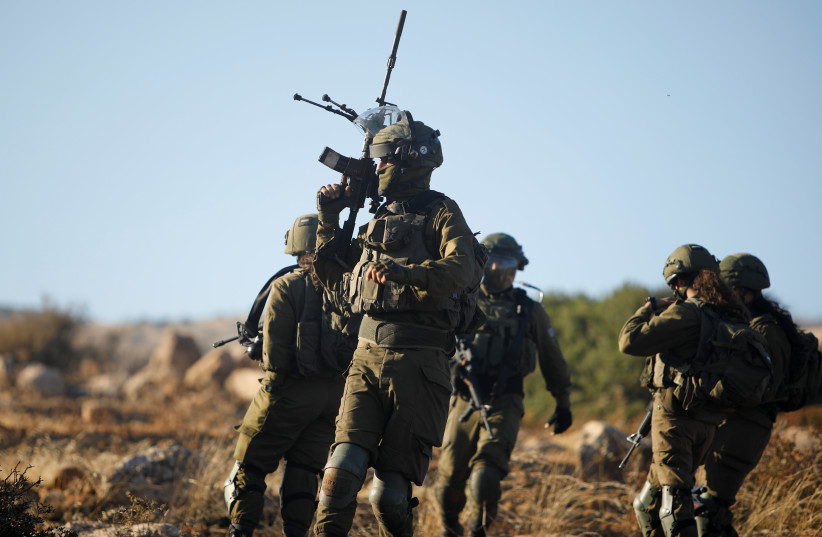 Israeli soldiers patrol the area following a flare-up of Israeli-Palestinian violence, near Tubas in Israel's West Bank, May 15, 2021. (credit: REUTERS/RANEEN SAWAFTA)