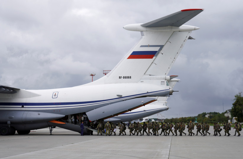  Russian paratroopers board an Ilyushin Il-76 transport plane as they take part in the military exercises "Zapad-2021" staged by the armed forces of Russia and Belarus at an aerodrome in Kaliningrad Region, Russia (photo credit: REUTERS)