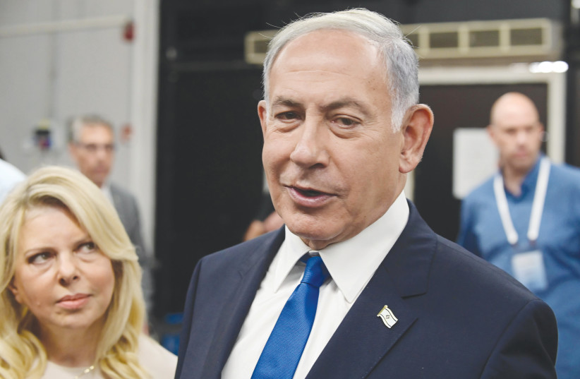  BENJAMIN AND Sara Netanyahu arrive at a polling station in Tel Aviv to vote in the Likud primary earlier this month.  (photo credit: TOMER NEUBERG/FLASH90)