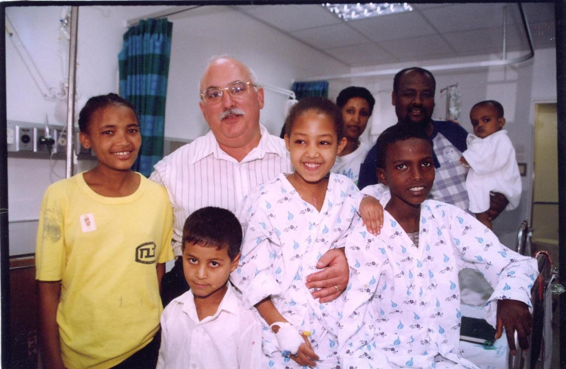  Founder of Save a Child’s Heart the Late Dr. Ami Cohen with Ethiopian and Palestinian children in 2001. (credit: SAVE A CHILD'S HEART)