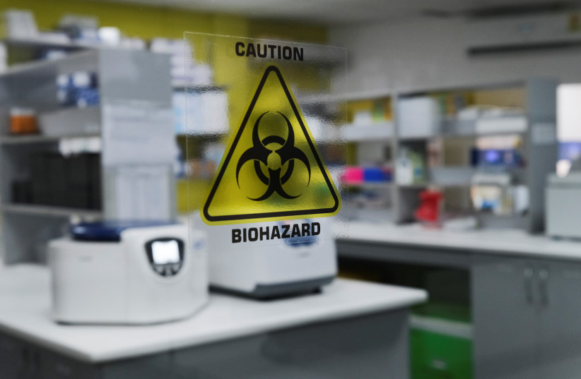  A biohazard warning sign is displayed at the Yemaachi Biotechnology cancer research laboratory in Accra, Ghana May 19, 2022. Picture taken May 19, 2022 (credit: FRANCIS KOKOROKO/REUTERS)