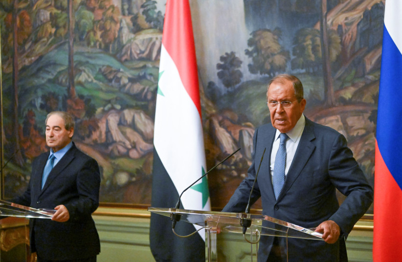 Russian Foreign Affairs Minister Sergei Lavrov and his Syrian counterpart Faisal Mekdad attend a news conference in Moscow, Russia August 23, 2022. (photo credit: Natalia Kolesnikova/Pool via REUTERS)