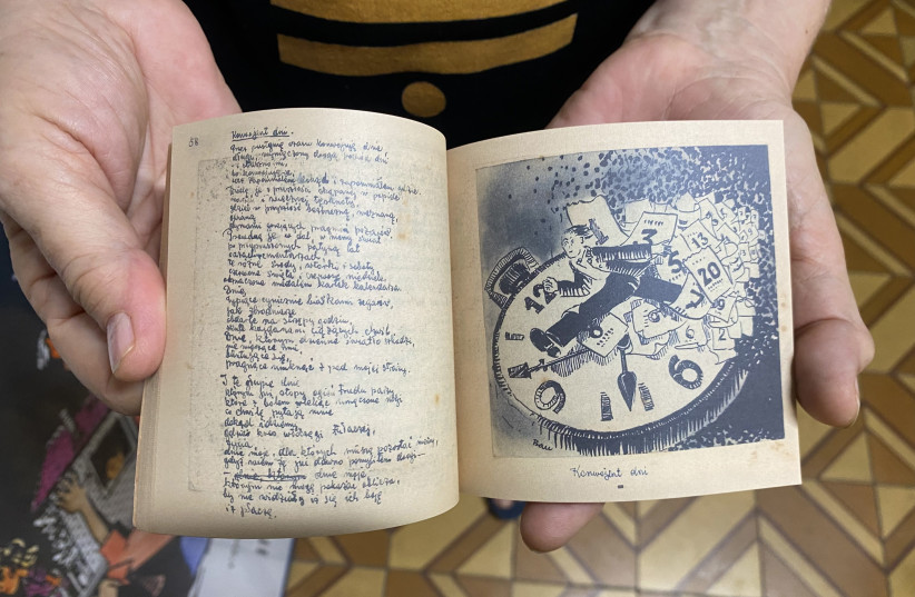  CLILA HOLDS ‘The World and I,’ a poetry book by her father. A prolific writer, in one of his books from the Holocaust, Bau drew a diagram of the Plaszow concentration camp – which director Steven Spielberg used to recreate the camp in ‘Schindler’s List.’ (credit: JOSEPH BAU HOUSE MUSEUM)