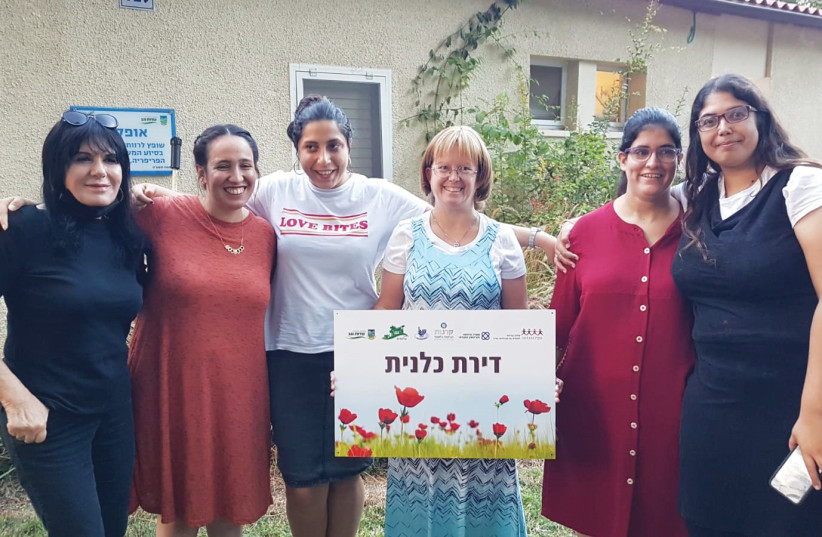  AT LEFT, with residents of the SHEKEL kibbutz apartment on Kibbutz Alumim.  (photo credit: SHEKEL)