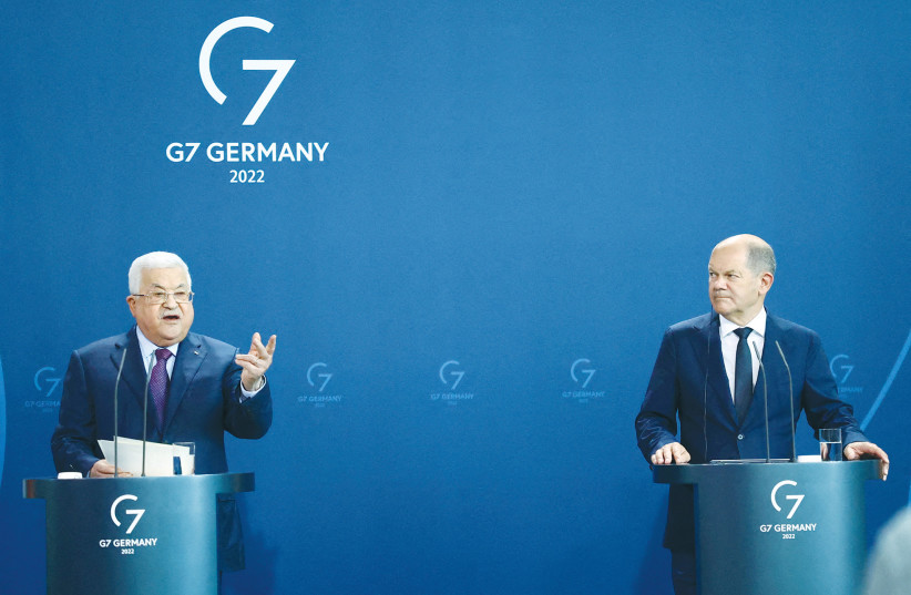  PALESTINIAN AUTHORITY head Mahmoud Abbas gestures during the news conference with German Chancellor Olaf Scholz in Berlin, earlier this month.  (photo credit: LISI NIESNER/ REUTERS)